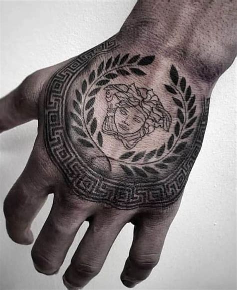 tatuaje versace|Versace head tattoo.